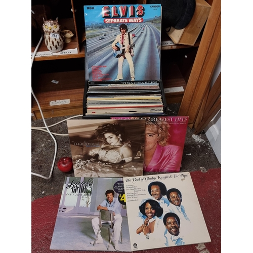 294 - A collection of fifty approx. LP vinyl records / albums from artists such as Madonna, Elvis, Rod Ste... 