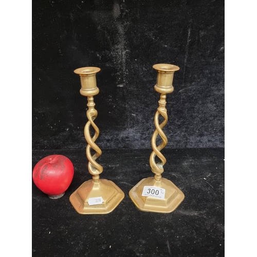 300 - A neatly sized barley twist brass candle holders.