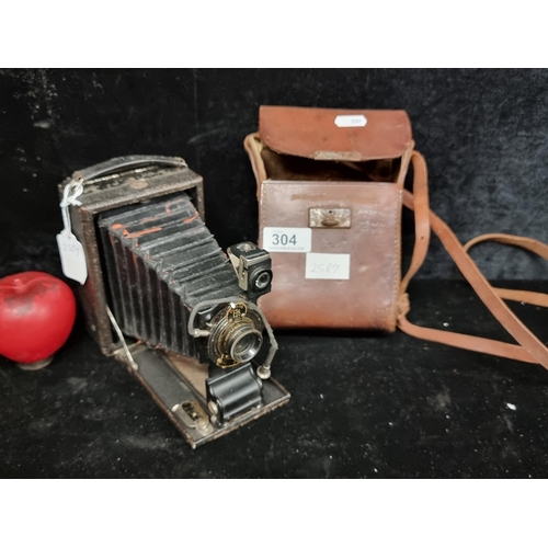 304 - A brilliant early 20th century Kodak ball bearing shutter folding camera. Comes with brown leather c... 