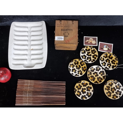 335 - A mixed lot of items comprising of a ceramic asparagus tray, a collection of chopsticks and five 