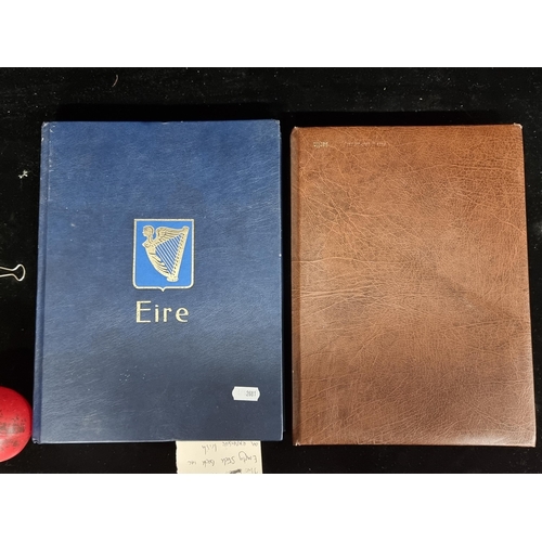 338 - Two never used empty stamp books including an expensive Irish pictural example.