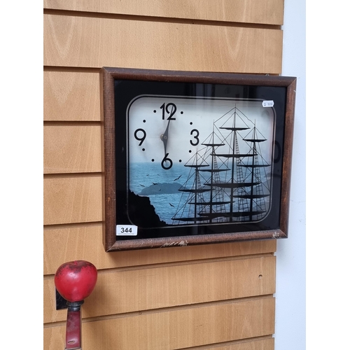 344 - An unusual wall clock with reverse painted glass featuring tall ship design. Housed in a wooden fram... 