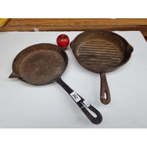 362 - Two antique cast iron skillets, one made by Swain in Ireland and the other an American Wagners examp... 