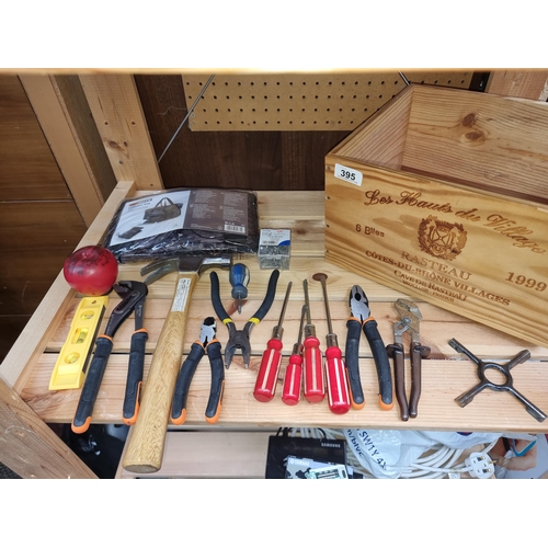 395 - A box with a collection of new tools.