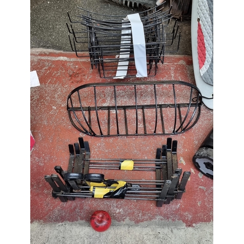 400 - A selection of metal flower basket holders and hanging basket brackets.