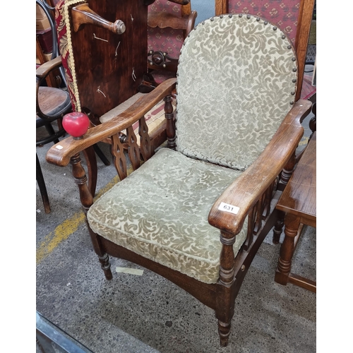 631 - An elegant antique Victorian Morris reclining armchair with intricately carved mahogany frame. Datin... 