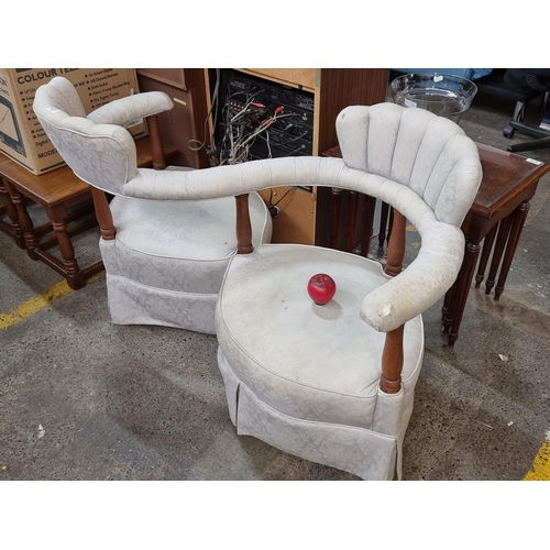 634 - Star Lot : A charming vintage conversation sofa, with scalloped backrests, turned wood supports and ... 