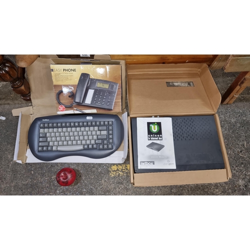 647 - An ergonomic NetBox keyboard, along with a Unison TV Internet box, model Netgem, complete with user'... 