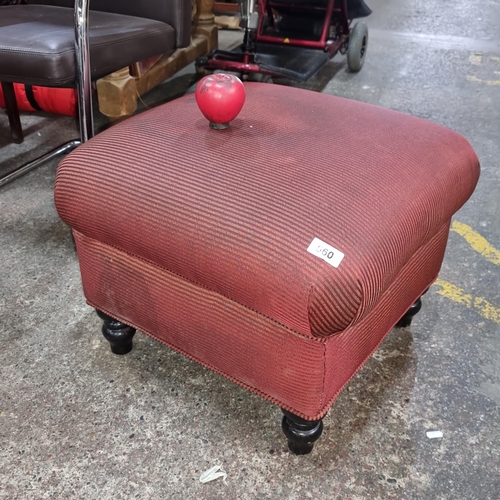 660 - A vintage ottoman / footstool upholstered in a scarlet and gilt pinstriped fabric and held on turned... 