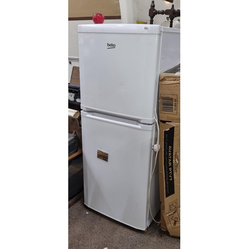 662 - A practical Beko refrigerator, featuring a top freezer compartment and a fresh food section below.