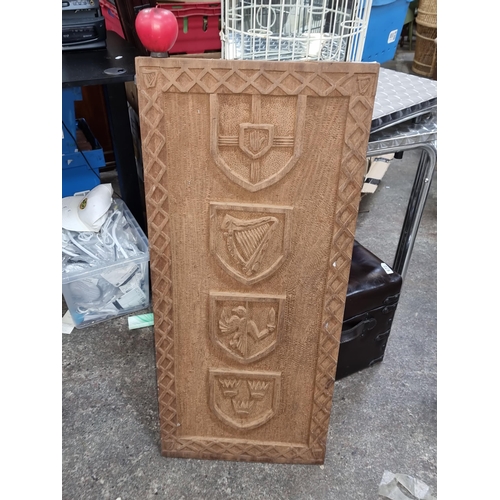 664 - A wonderfully carved wooden panel depicting the four provinces of Ireland.