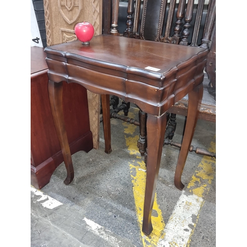 666 - Star Lot : Elegant mahogany side table opening to reveal an as new cutlery canteen. Featuring Queen ... 