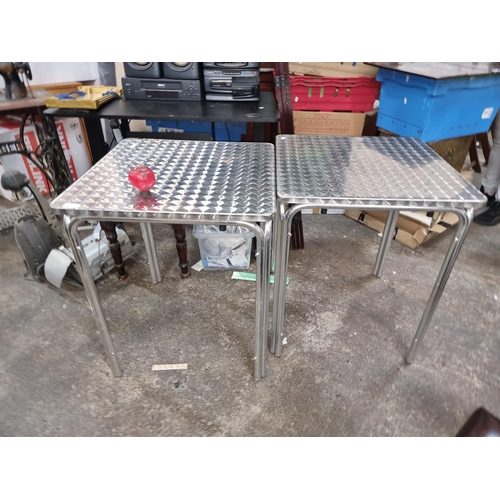 671 - A pair of aluminium patio tables. Ideal for restaurants / Cafes!