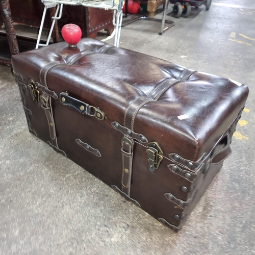 672 - A handsome contemporary leather topped stool in the form of a trunk. Top opens to reveal internal st... 