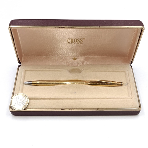 540 - A Cross ball point pen set in 18 carat rolled gold in original box.