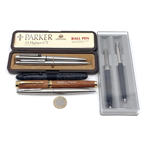 546 - A collection of assorted pens consisting of a fountain pen with gold iridium nib. Together with a Pa... 