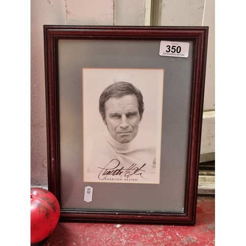 350 - A hand signed photograph of Charlton Heston (b.1923 - d.2008). The Planet of The Apes actor Heston g... 