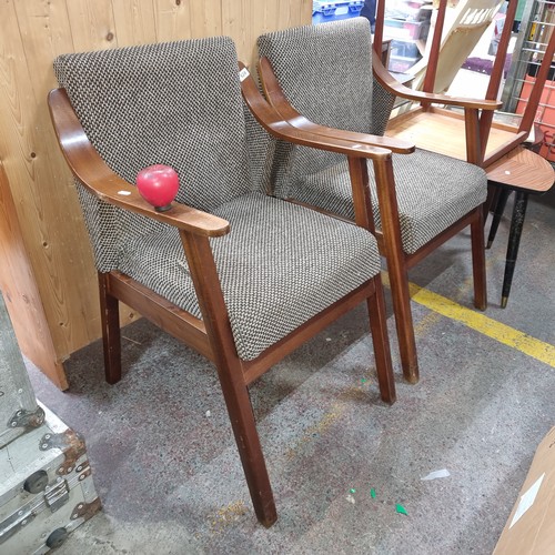 624 - Star Lot : A stylish pair of Mid century armchairs with upholstered back and seat, one featuring an ... 