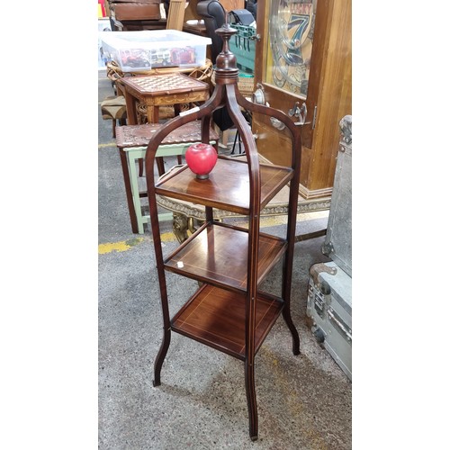 618 - Star Lot : A fabulous Edwardian mahogany three tiered cake stand boasting beautiful string inlay and... 