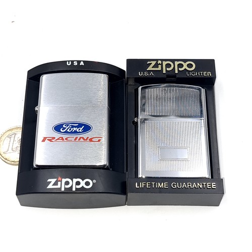 574 - Two unused Zippo lighters. A machine cut example together with a Ford racing.