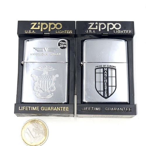 570 - Two unused Zippo lighters. The first featuring Manchester Pride of Europe. Second entitled American ... 