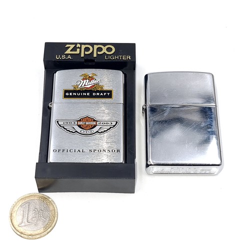 571 - Two unused Zippo lighters. The first in original unmarked condition together with a Miller genuine d... 