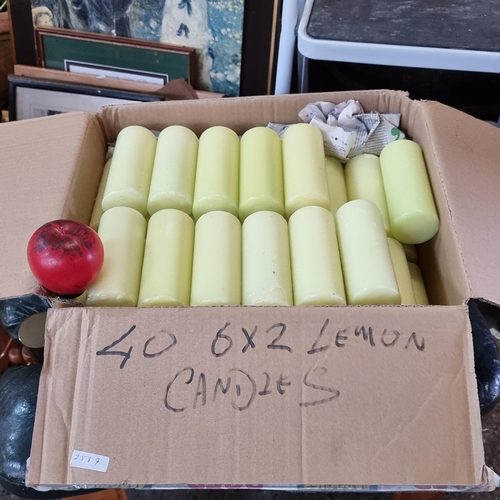 909 - A boxed lot of lemon-scented church candles. Approx. 40 pieces. These are from a church supply compa... 