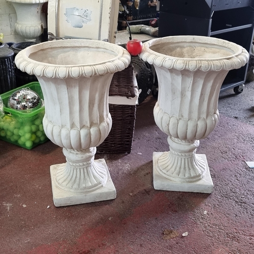 913 - A robust but lightweight pair of urns, fluted design with classic pedestal bases