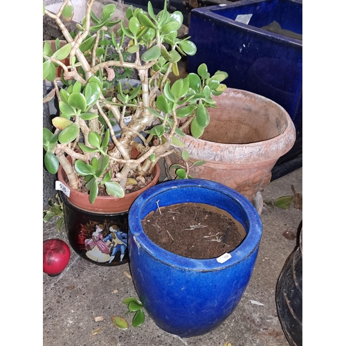 926 - Three garden planters, inc a vibrant cobalt blue glazed ceramic planter, A black example with an 18t... 