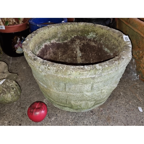 928 - A large vintage stone style planter, exhibiting a rich patina.