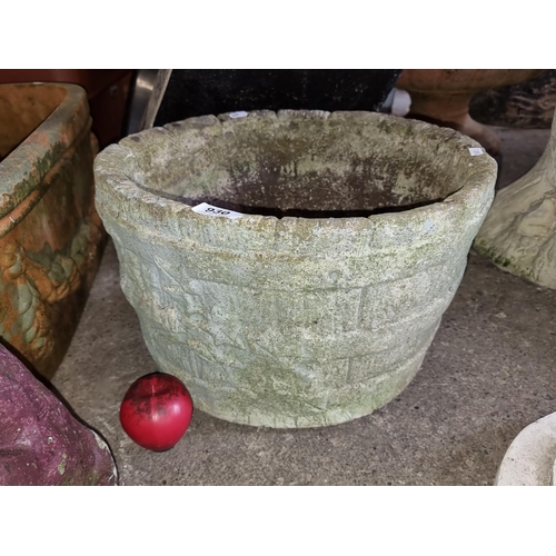 930 - A large vintage stone style planter, exhibiting a rich patina.