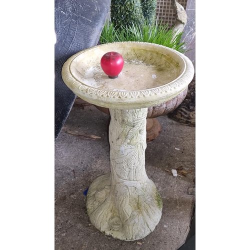 933 - Ornate garden birdbath, featuring nature-inspired relief patterns.