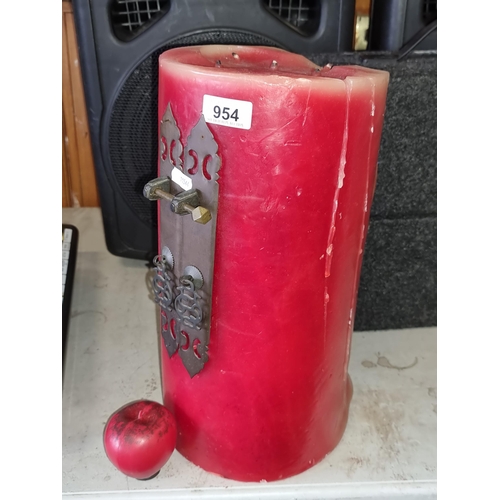 954 - Intriguing large vintage-style red wax candle with decorative metal latchwork, lending a warm, ambie... 