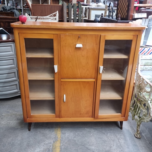 970 - Star Lot : A fabulous mid-century modern Display cabinet in rich teak construction with ample storag... 