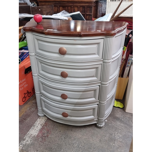 976 - Star Lot : A handsome demilune 4 drawer chest with columnar accents and matching warm mahogany top a... 