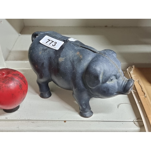 773 - A very heavy antique original  humorous cast metal piggy bank.