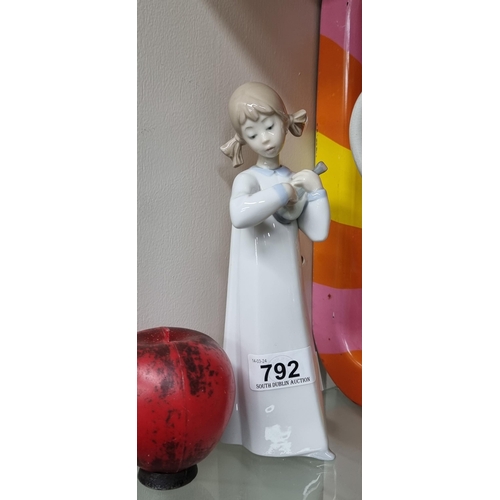 792 - A pretty piece of Spanish Lladro porcelain depicting a young child playing a mandolin. In VGC.