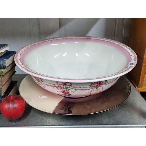 827 - Two items including a stunning oversized famille rose ceramic bowl, along with a large decorative ce... 