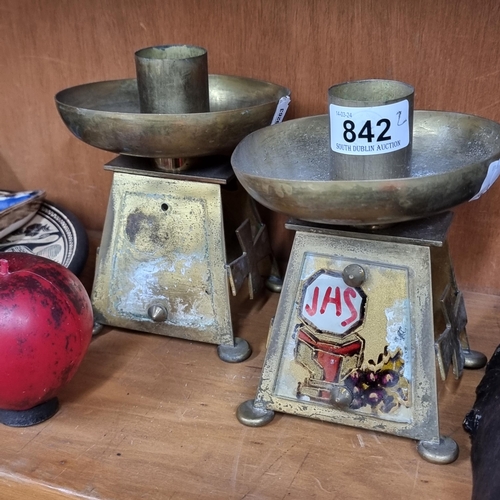 842 - Two solid brass ecclesiastical style candle stick holders.