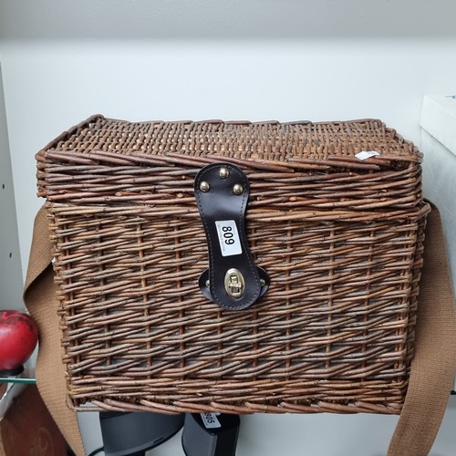 809 - A wonderful wicker picnic basket comprising of a fine selection of plates, cutlery, glasses and a fl... 