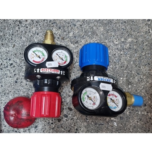 866 - One oxygen regulators along with one acetylene regulators.