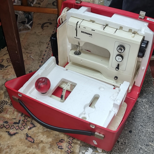 888 - An excellent rare Bernina 830 sewing machine including an extension table, case and instruction manu... 