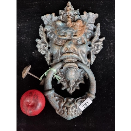 261 - A superb very large cast iron heavy gothic doorknocker in the form of a demonic face. Its an amazing... 