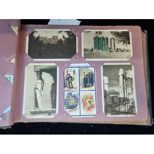 142 - A wonderful antique post card album containing Italian, British and Irish examples. Approx 70% full.