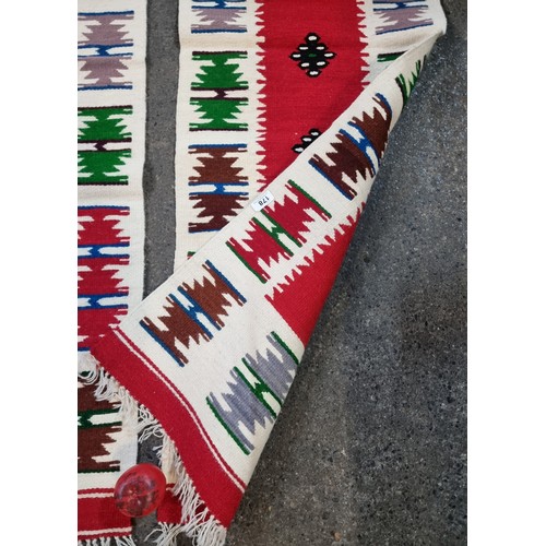 178 - Star Lot : Two stunning hand made Southwest possibly native American Navajo flatweave rugs in gorgeo... 