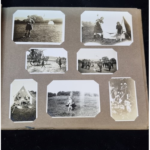 226 - A beautiful early 20th century photo album containing a wonderful selection of miniature scouting th... 