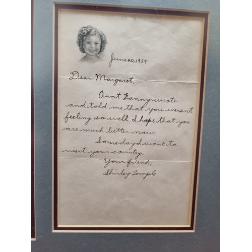 353 - Star lot : A wonderful piece of film memorabilia comprising of a hand sided photo of Shirley Temple ... 