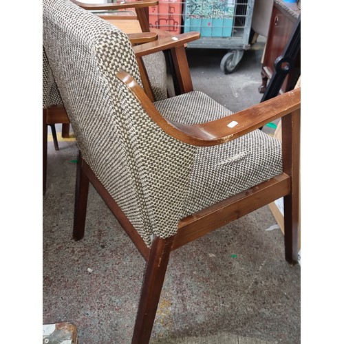 624 - Star Lot : A stylish pair of Mid century armchairs with upholstered back and seat, one featuring an ... 