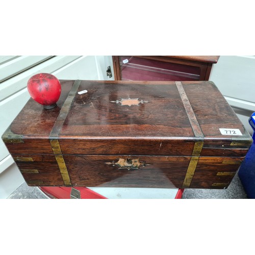 772 - A handsome antique mahogany writing box. Featuring brass hardware and a burgundy suede writing slope... 