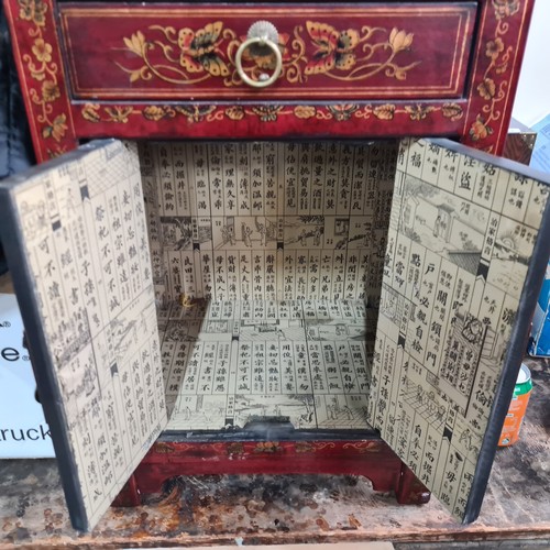 962 - Ornate Chinese cabinet, red lacquer with gold leaf butterflies and florals, brass hardware, imbued w... 